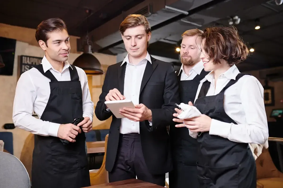 serious-restaurant-manager-dividing
