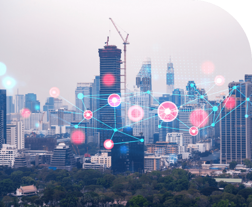 City skyline with digital network overlay of connected sensor nodes highlighting activity across buildings