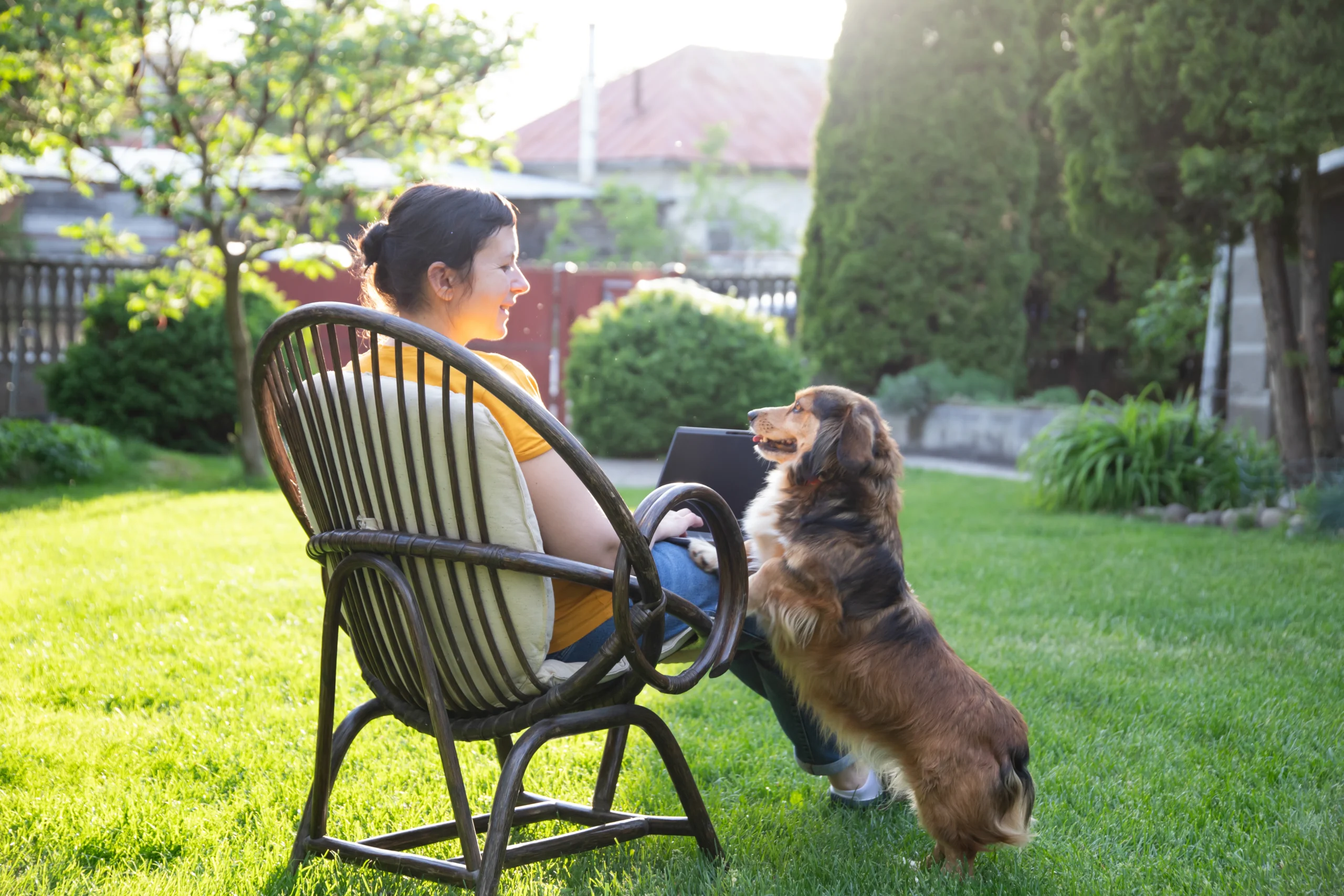 woman and dog enjoying a flea-free yard