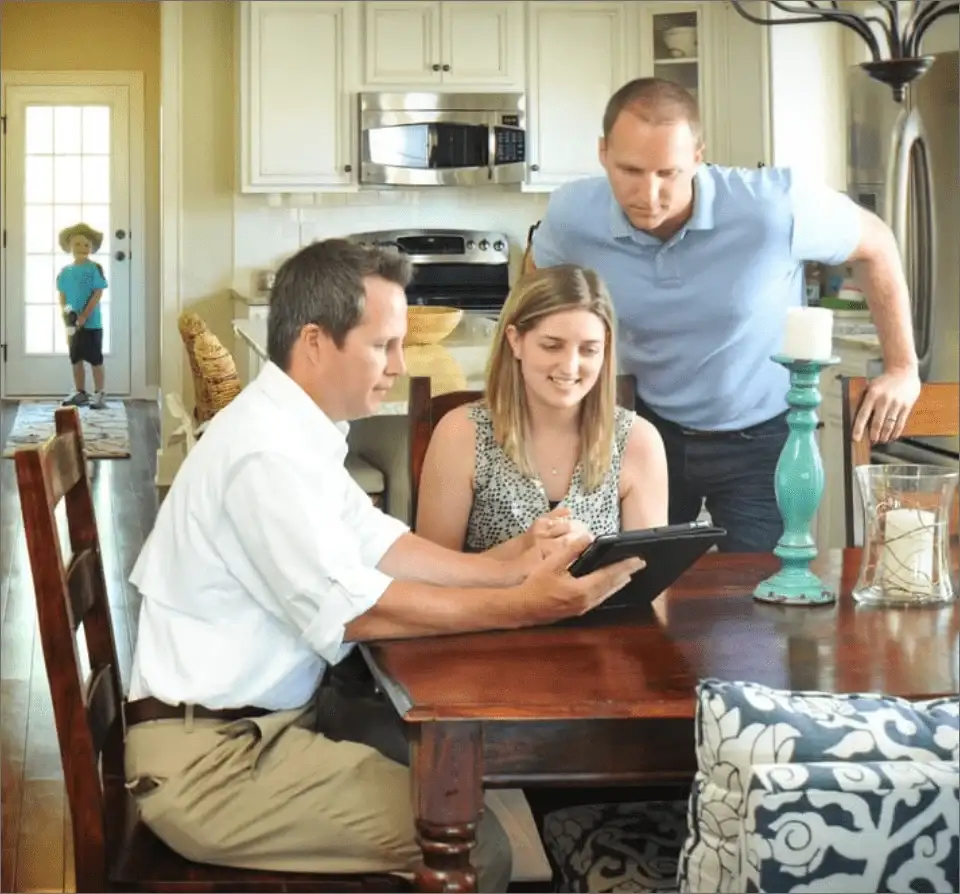 pest control technicians discussing services with customers