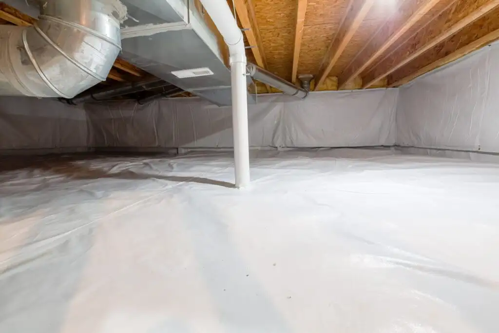 Crawl space with white vapor barrier lining floor and walls, exposed wooden joists, ductwork, and a vertical support pipe