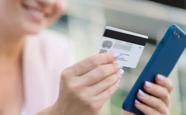 businesswoman-with-a-credit-card-and-phone