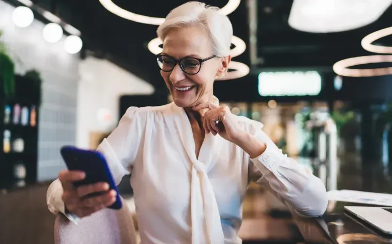 cheerful-senior-woman-sitting-with