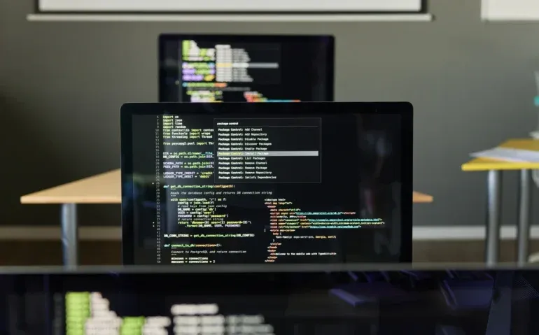 computer-code-displayed-on-multiple-computer