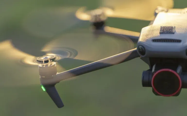 drone-technology-in-the-air-over-green-background.webp