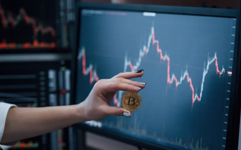 front-view-woman-s-hand-holding-bitcoin