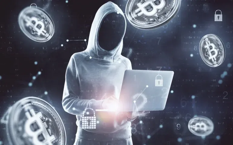 hooded-figure-and-bitcoin-cryptocurrency