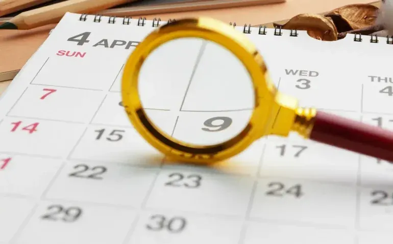 magnifying-glass-and-calendar