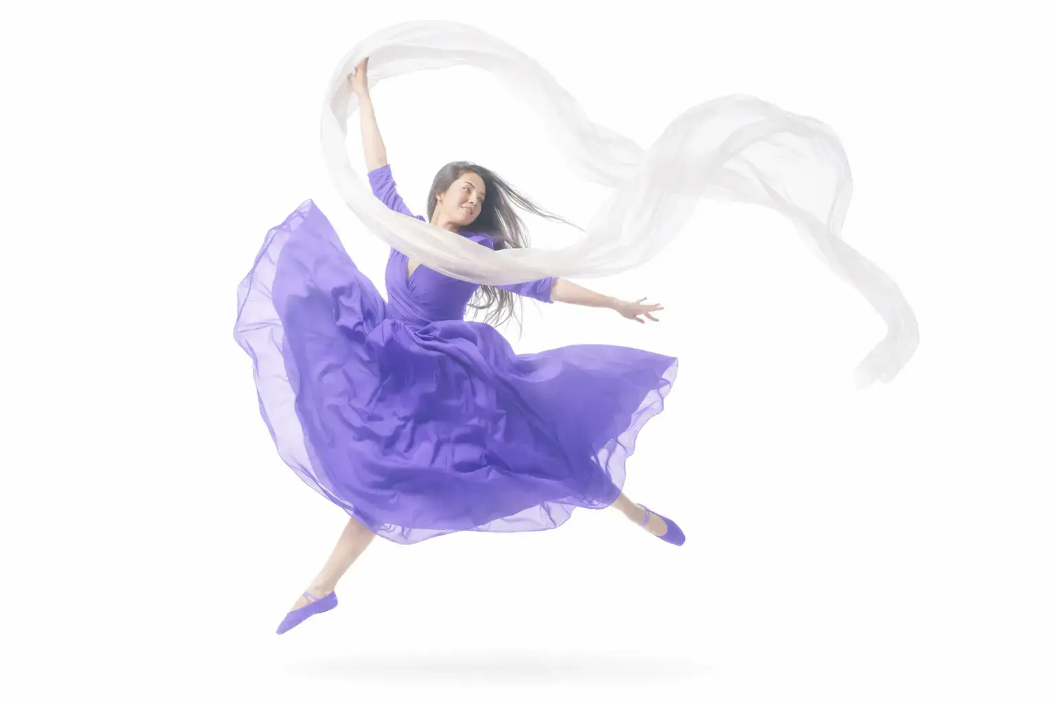 A woman in a flowing purple dress leaps gracefully in the air, holding a white, billowing scarf above her head—her joyful energy reminiscent of creative web site design against a plain white background.
