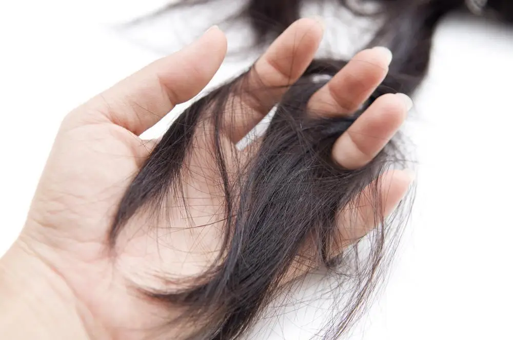 Woman holding a strand of hair