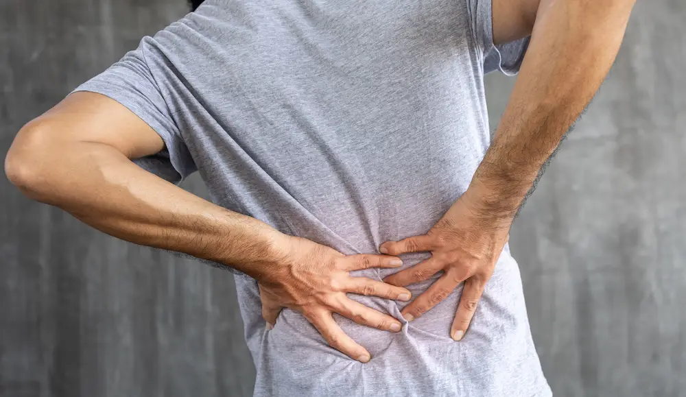 Young man having low back pain