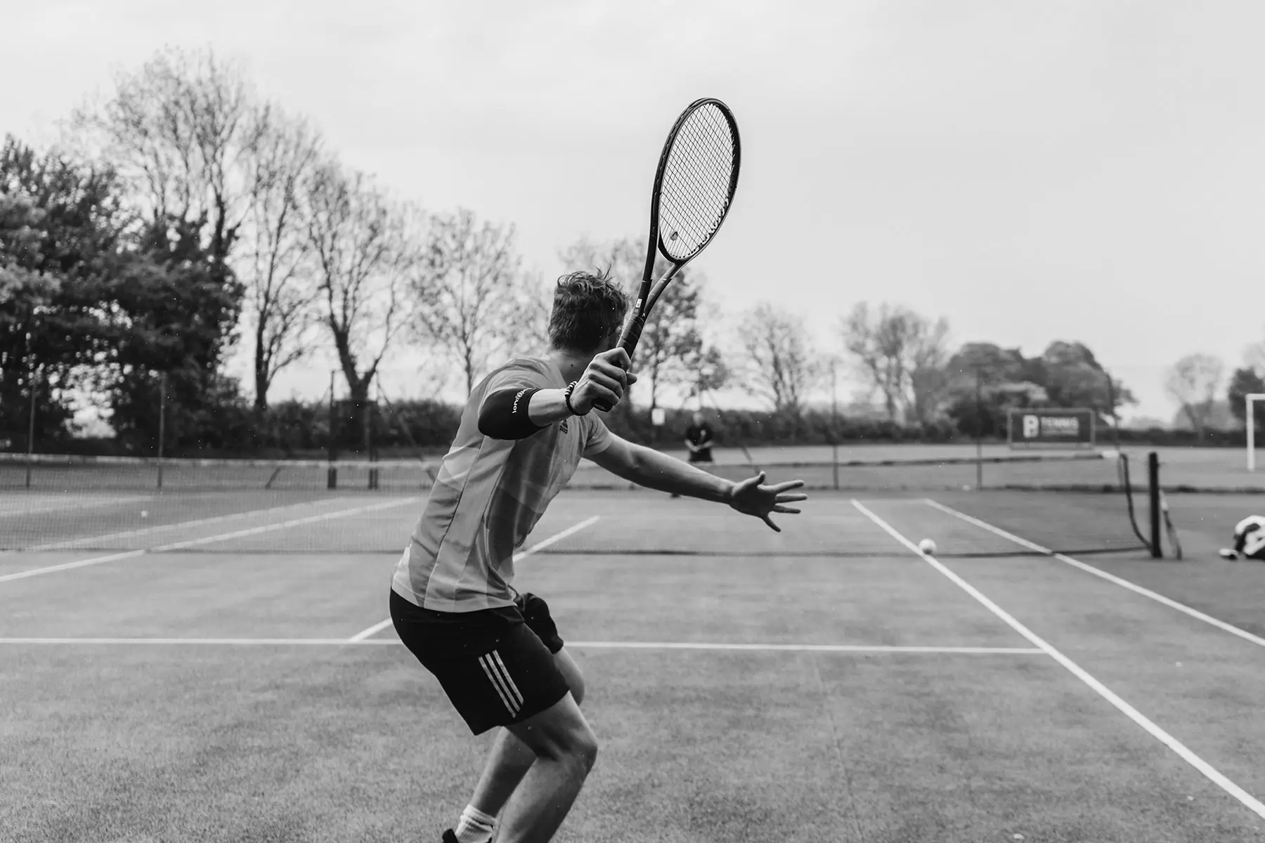 Tennis player swinging a racket