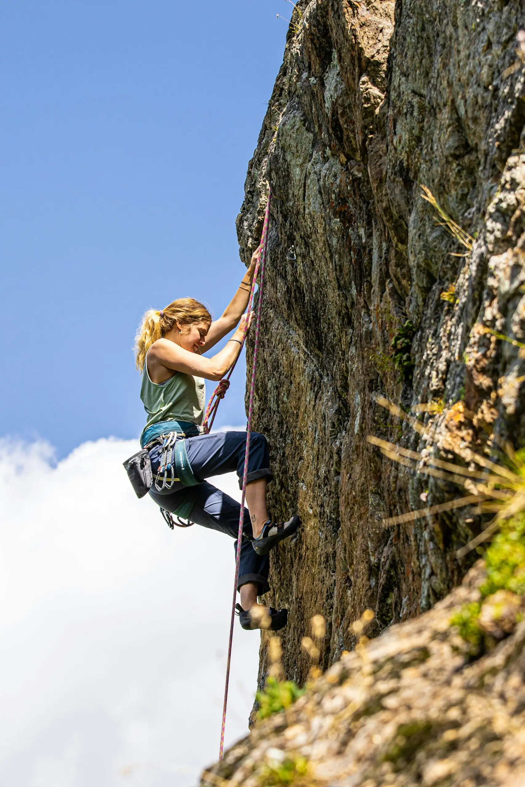 Woman climbing a mountain