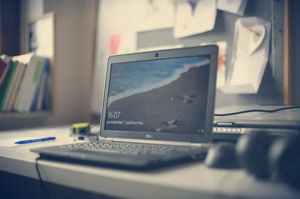 IT engineer troubleshooting a business laptop during on-site IT support visit
