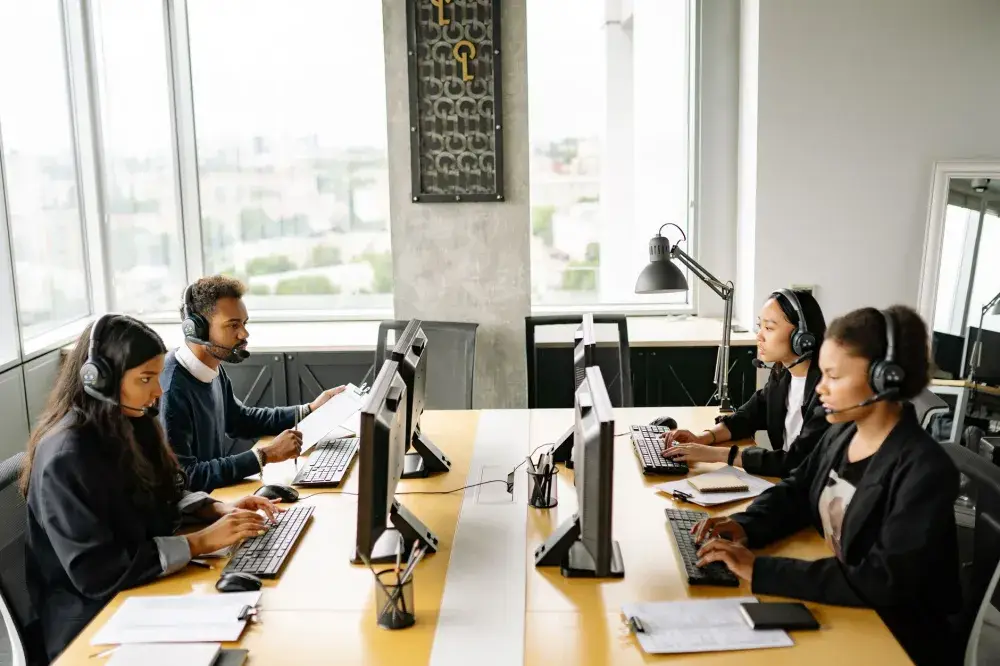 Office team working productively after professional IT support services in JVC