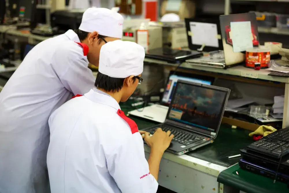 Technician performing data migration from old storage to new NAS system in Dubai
