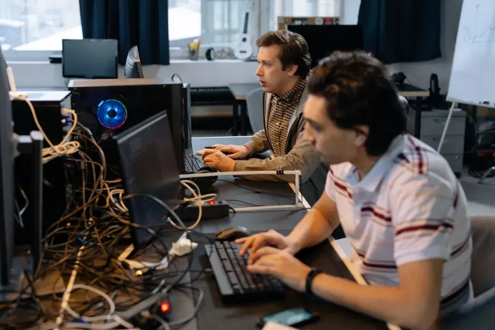 Business team working on computers after successful Windows Server setup in Dubai Internet City