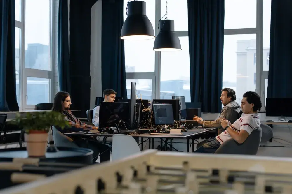 Office team working productively on computers covered by an IT AMC contract in Downtown Dubai