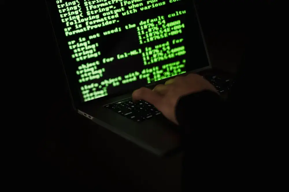 Microsoft Defender security dashboard displayed on a laptop screen in an SME office