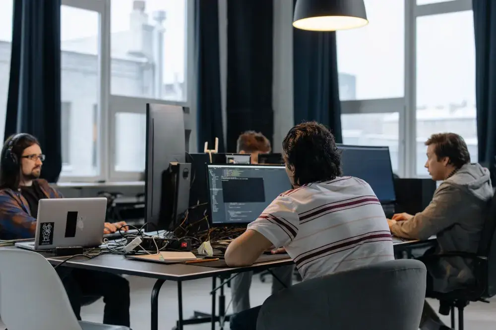 IT support engineer testing office network connection on a laptop in Dubai