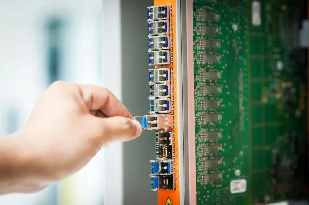 IT engineer configuring QNAP NAS backup settings for a Dubai SME