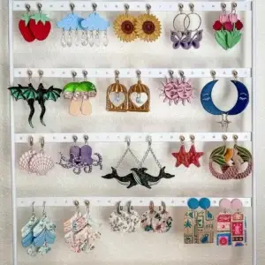 Collection of vibrant, unique handmade earrings featuring whimsical nature, fantasy, and abstract designs.