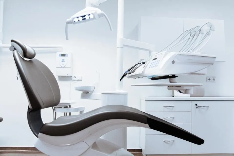 Modern dental treatment chair where a dentist can find the cause of a black tooth