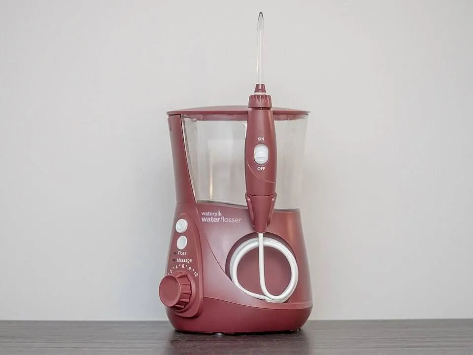 Water flosser (oral irrigator) used for cleaning around braces