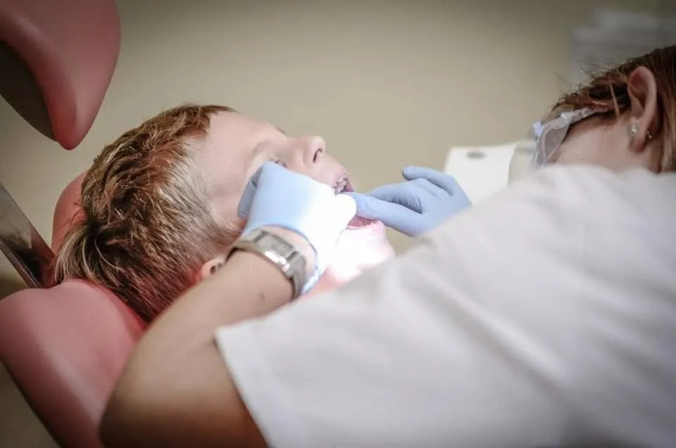 Young patient in the dental chair during a wisdom teeth consultation