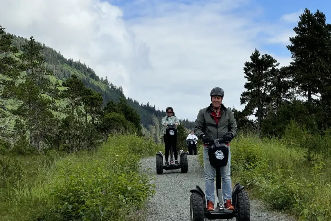 Top 10 Alaskan Tours You Can’t Miss: A Complete Guide for Travelers 3 Visitors on a Juneau Segway tour exploring a lush Tongass National Forest trail.