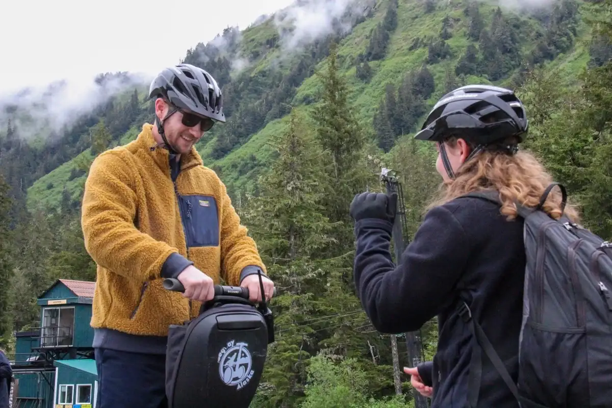 Juneau-alpine-segway-training-mountain-nature-fun-1200x800 Guests wearing helmets on an iRide Alaska Segway tour in the Juneau rainforest.