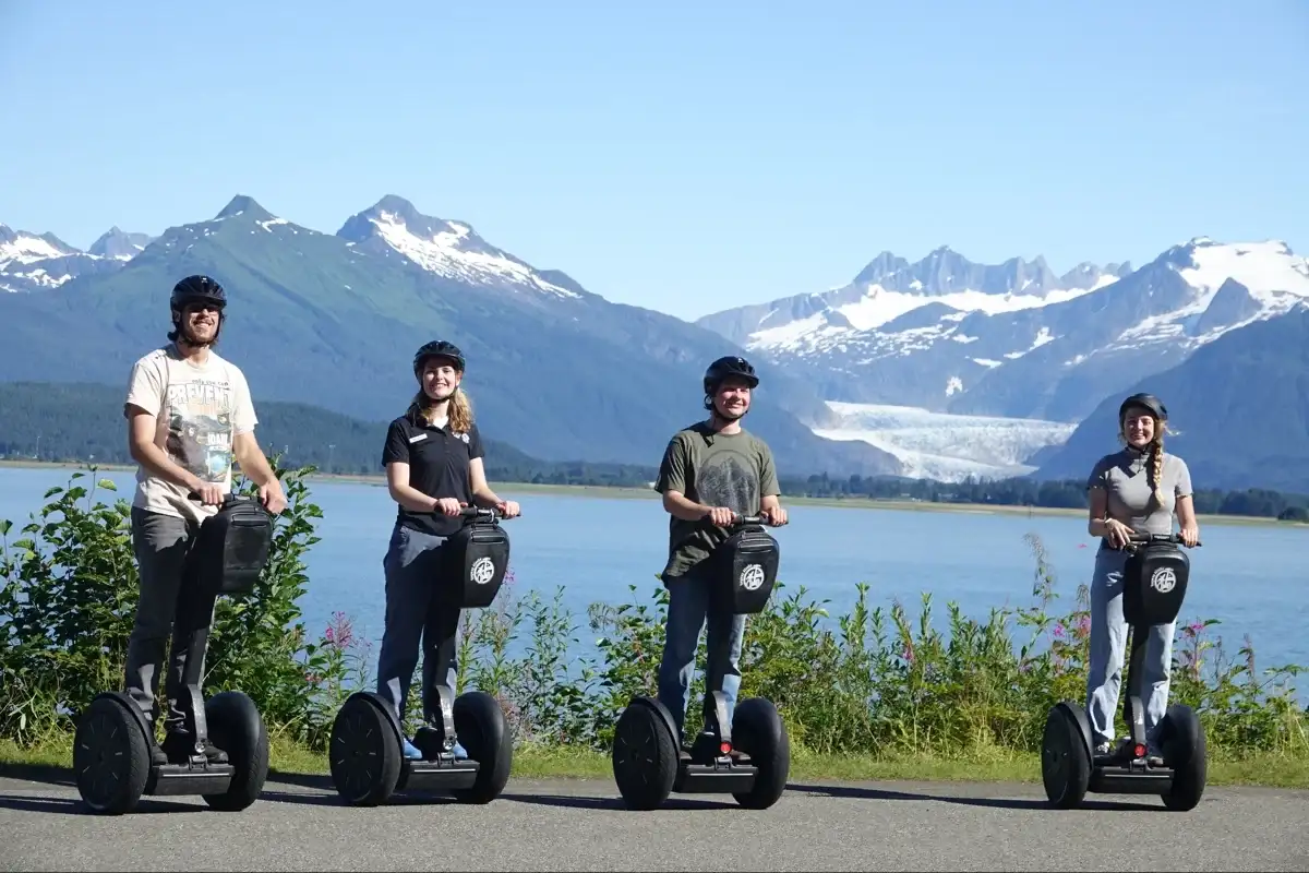 Segway Tour Requirements: Weight, Age & Safety | iRide Alaska 3 Four guests on an iRide Alaska Segway tour overlooking Juneau's Mendenhall Glacier and mountains.