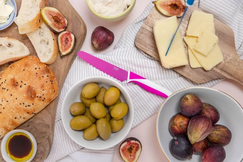 Pink KiddiKutter on a cheese and fruit platter