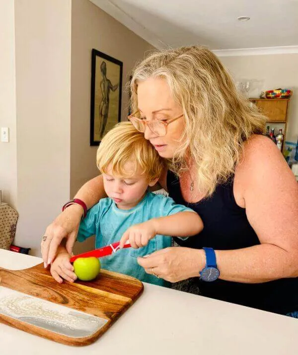 Parent and child preparing food with a Red KiddiKutter