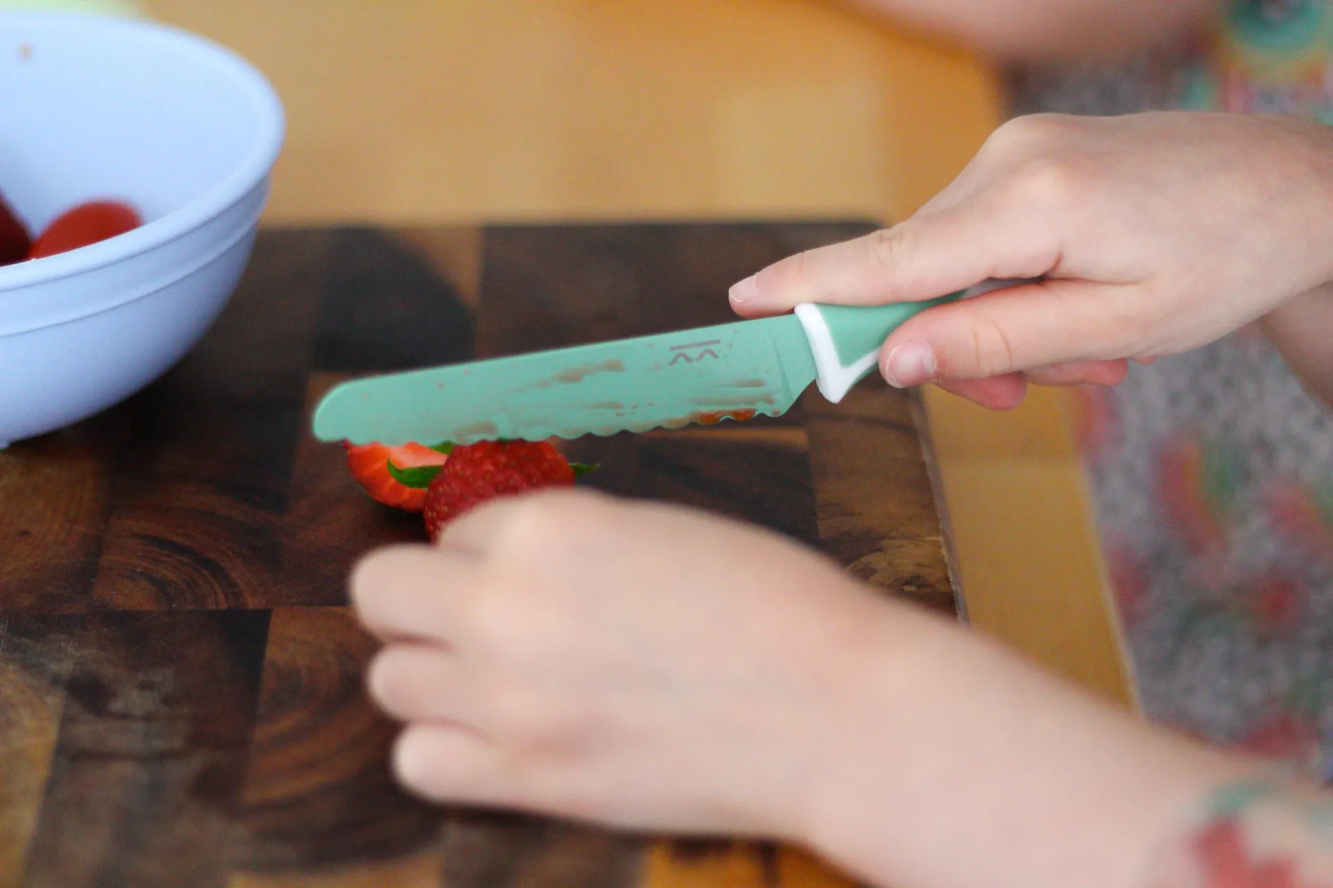 Child holding a Sea Green KiddiKutter
