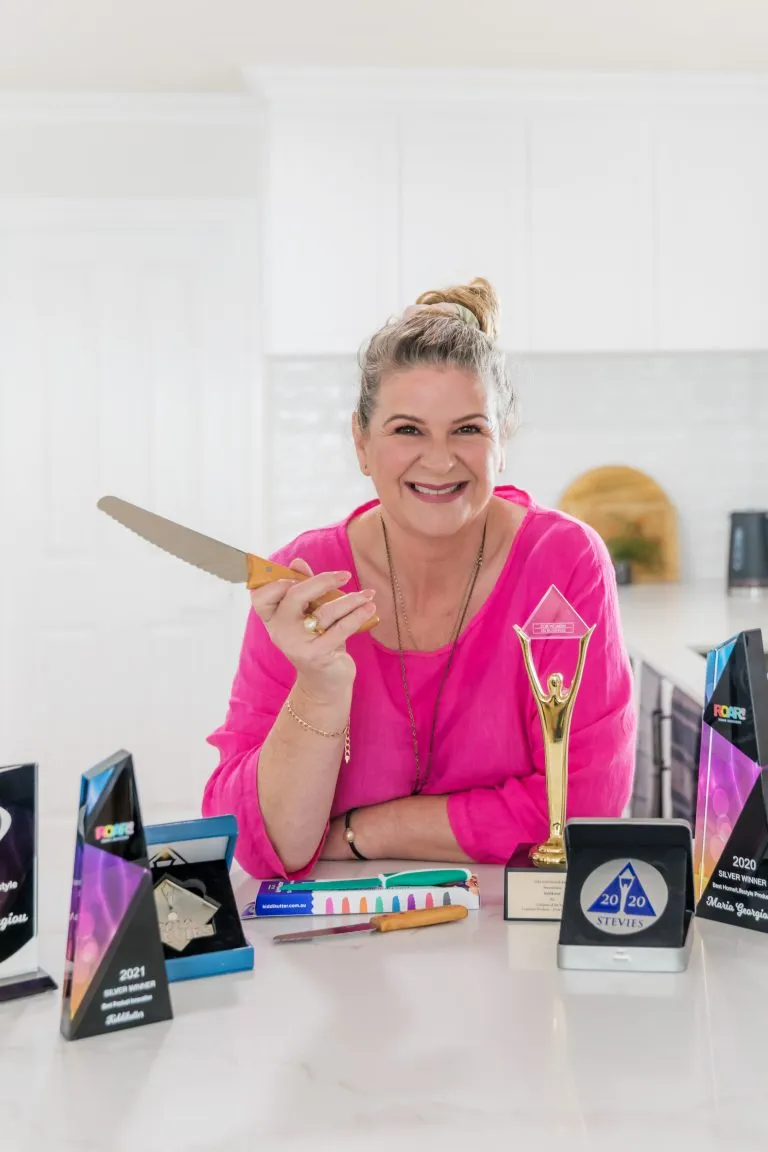 KiddiKutter founder Maria celebrating an award win