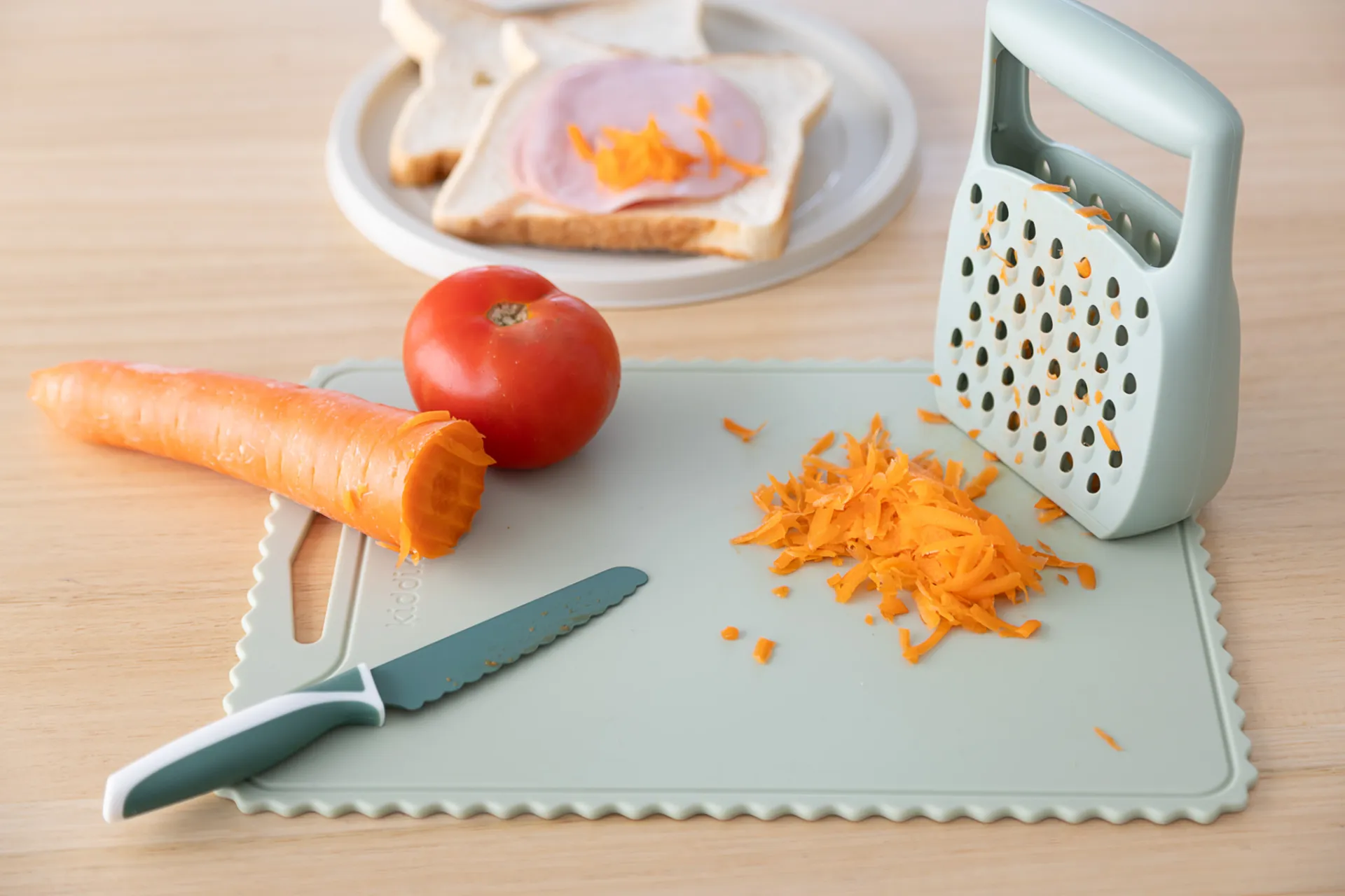 KiddiKutter safer grater with grated carrot