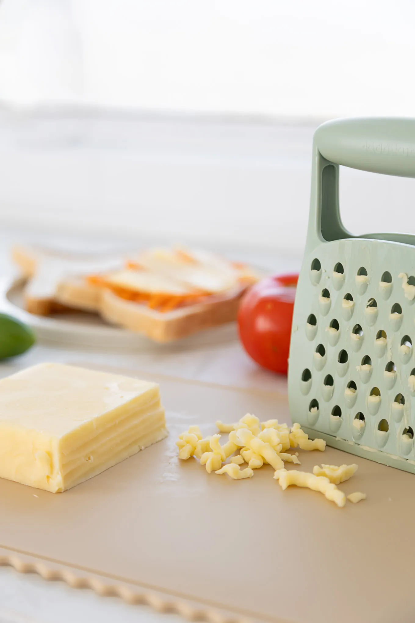KiddiKutter safer grater with grated cheese