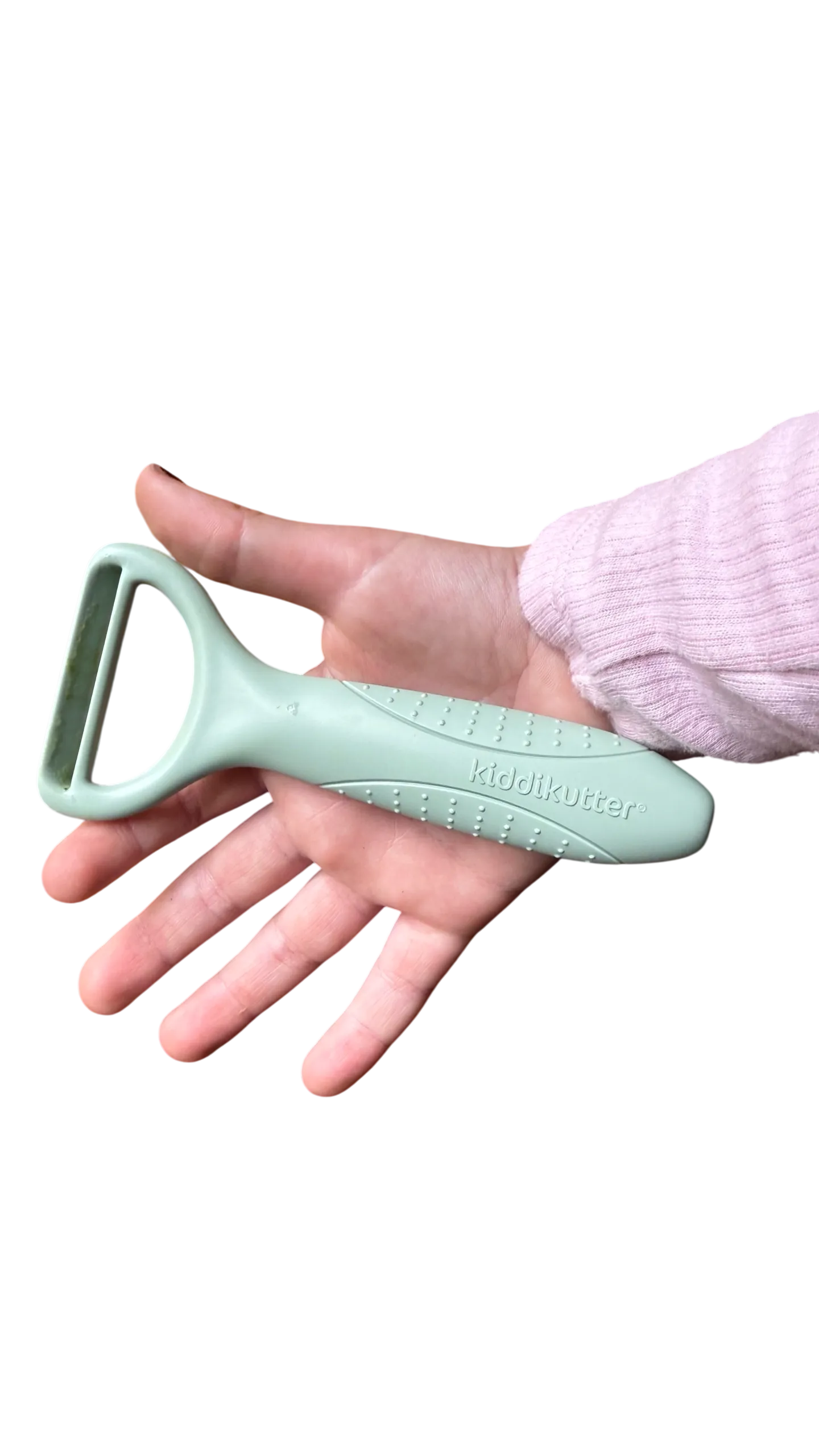 Kiddikutter Safer Peeler resting in a hand, showing its compact size and textured grip