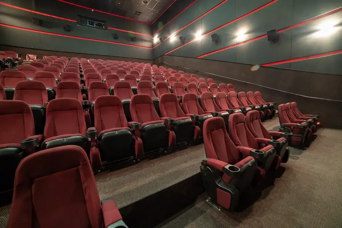 screen-and-red-velvet-seats-empty-cinema-