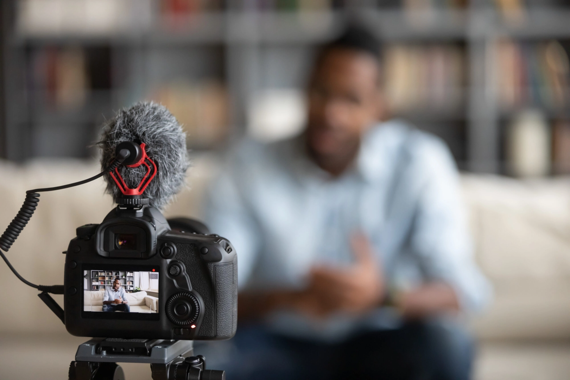 Video Confessional Booth Rental: A Practical Planning Guide - Lucky Frog Photo Marketing Professional camera shooting biracial blogger making vlog