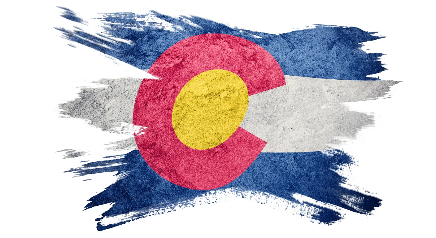 Colorado flag graphic representing the state's spring skiing tradition