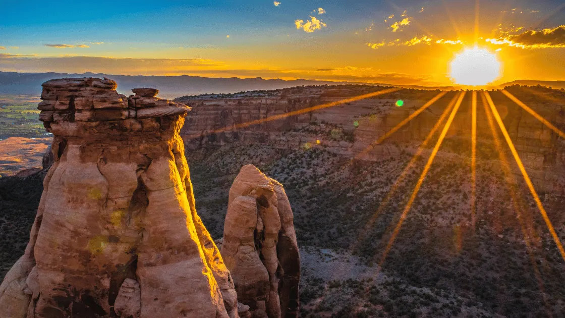 Colorado living mountain sunrise with peaks and sunshine