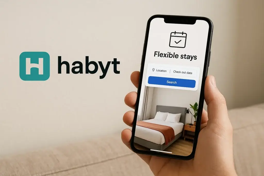 What Is Habyt App and How Does It Work? 1 Smartphone showing Habyt mobile app interface for booking flexible stays in furnished co-living apartments with location and date options.