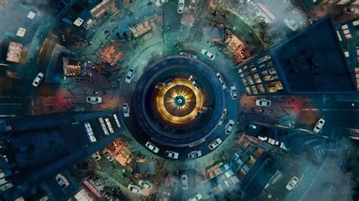 Uber Clone 16 Aerial view of city roundabout with moving cars and urban traffic flow