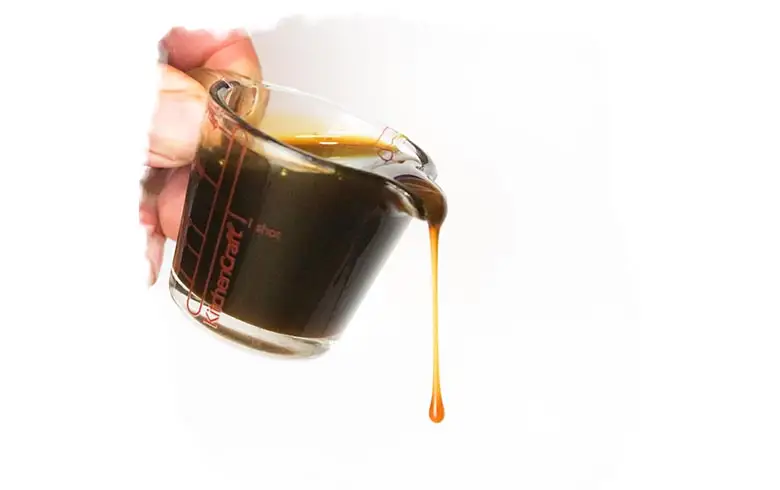 A small jug of yacon being poured