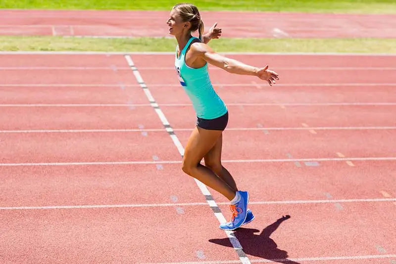 An Athlete winning a running race