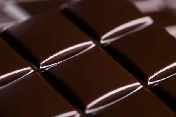 Closeup of a glossy dark sugar free chocolate bar