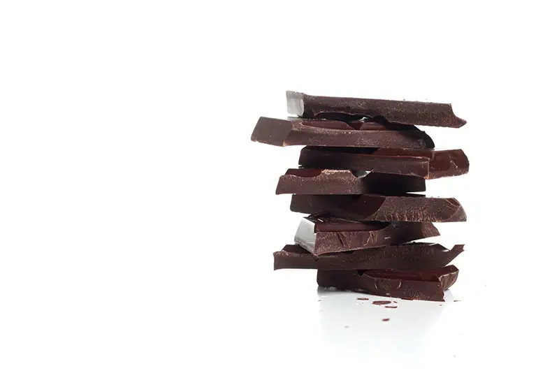 Dark chocolate pieces stacked