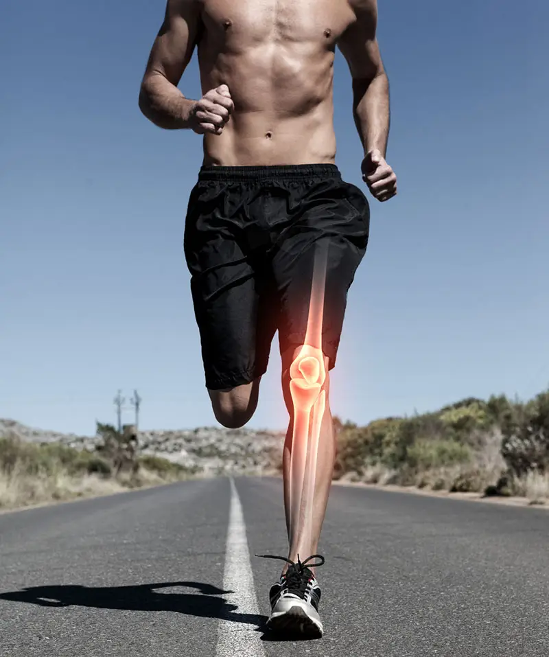 Highlighted knee and bones of running man
